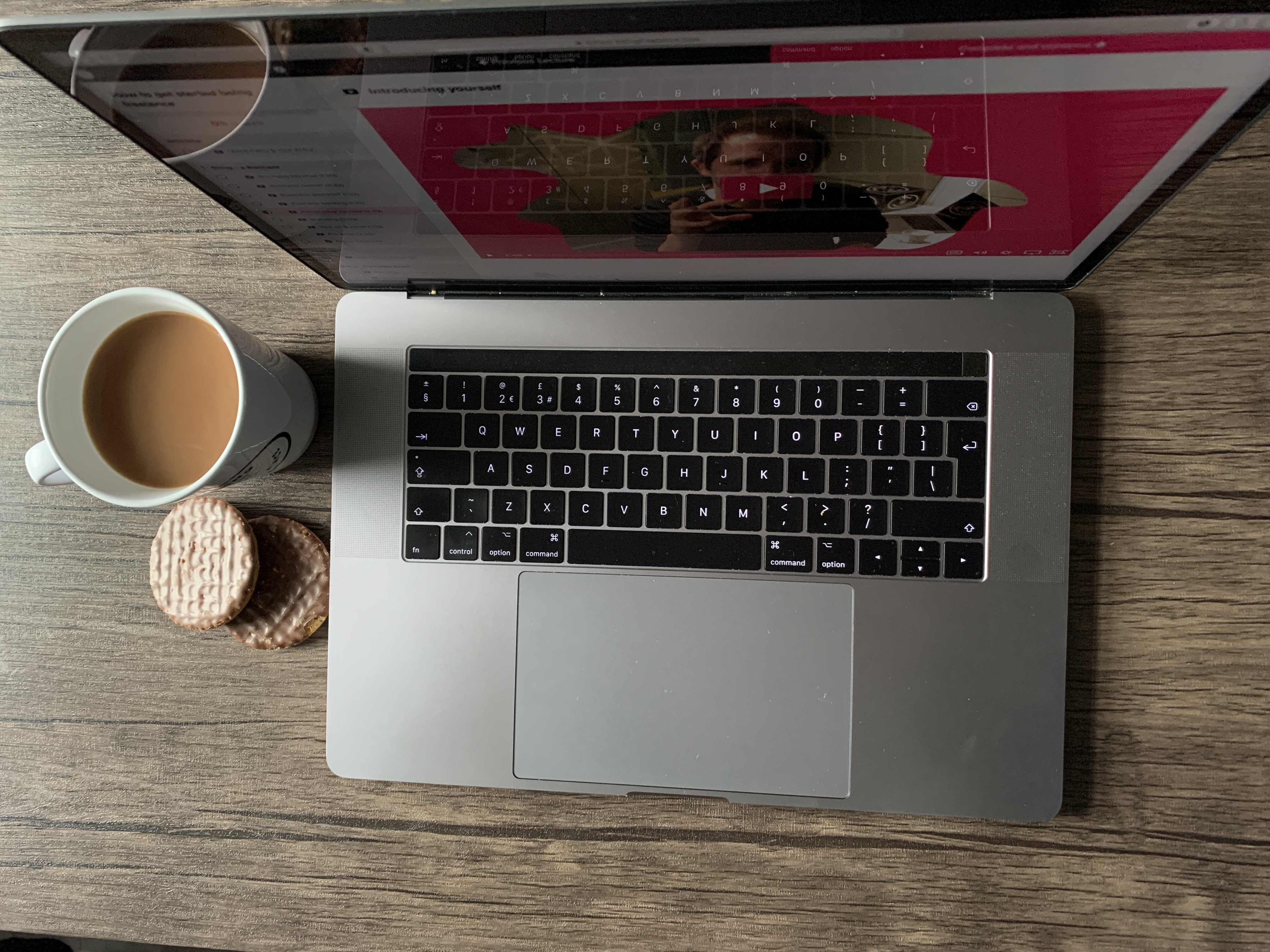 Being Freelance mug in foreground with laptop showing course behind