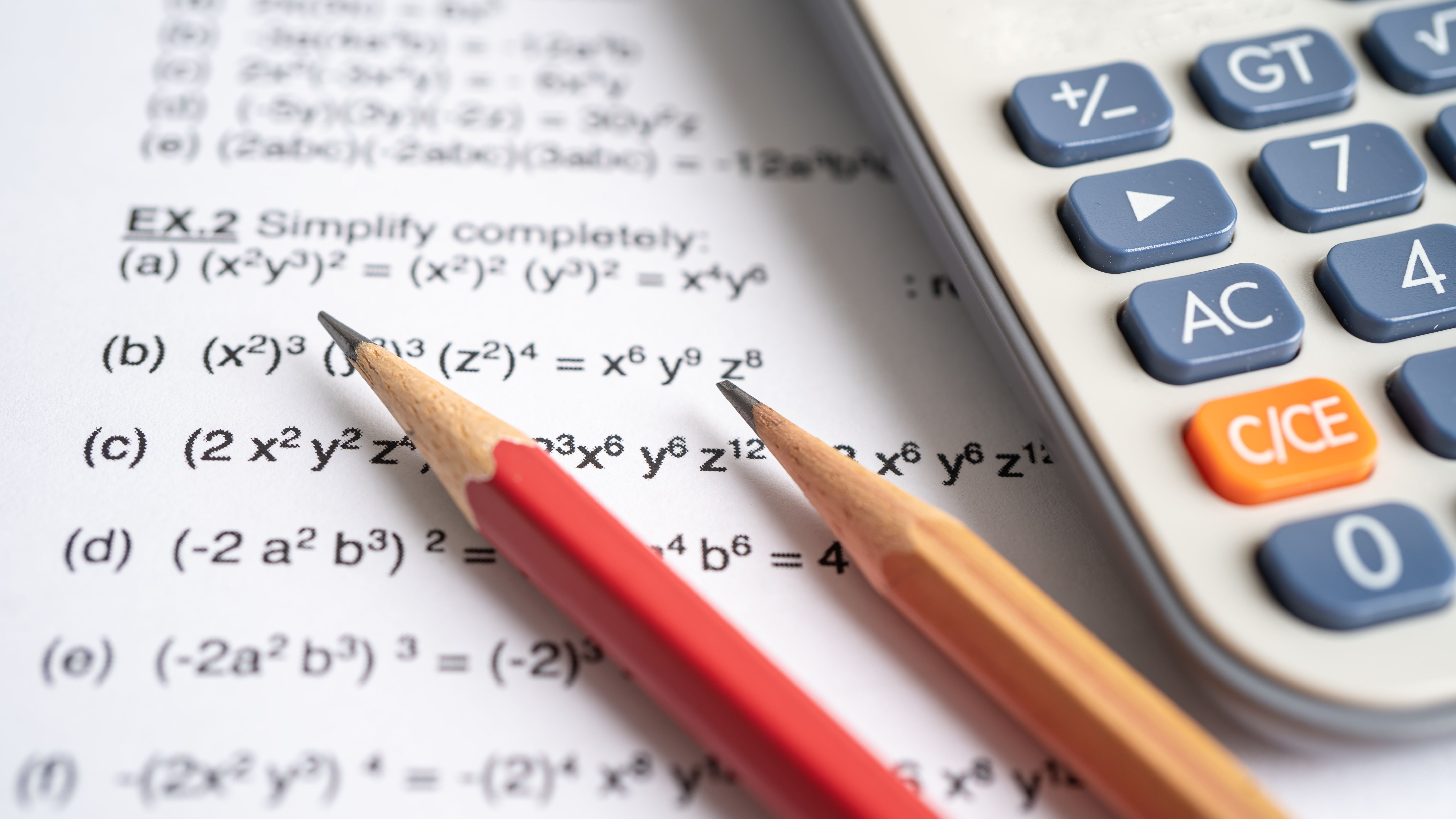 pencils and math worksheet with calculator