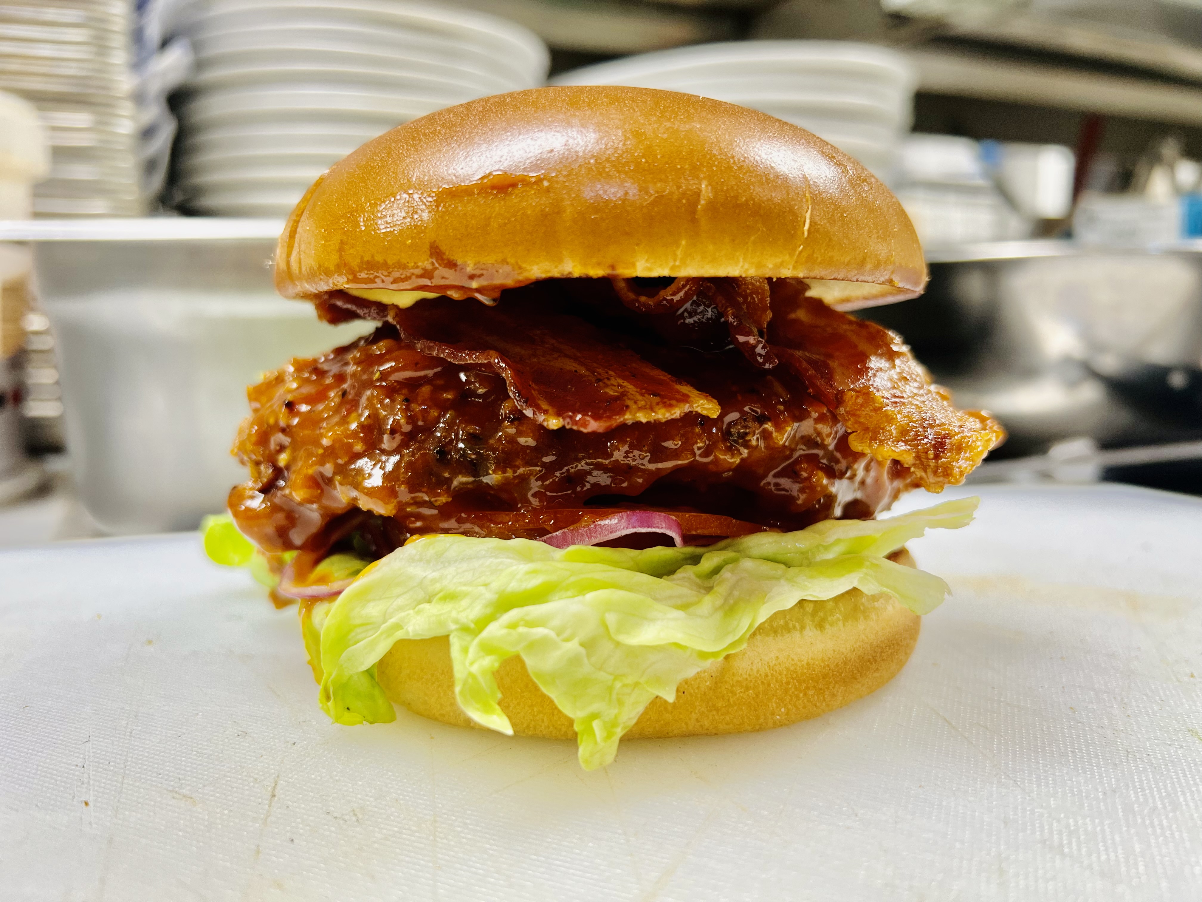 Spicy BBQ Bacon Chicken Sandwich with lettuce & tomato.