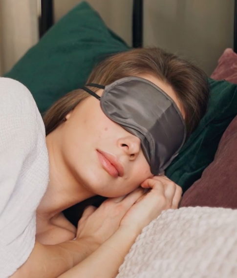woman sleeping with eye mask