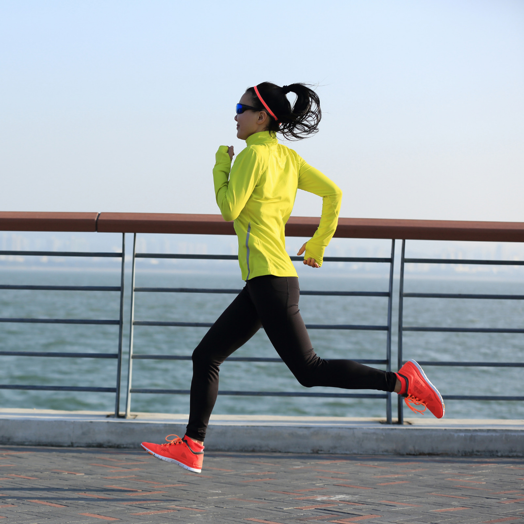 woman running next to the beach