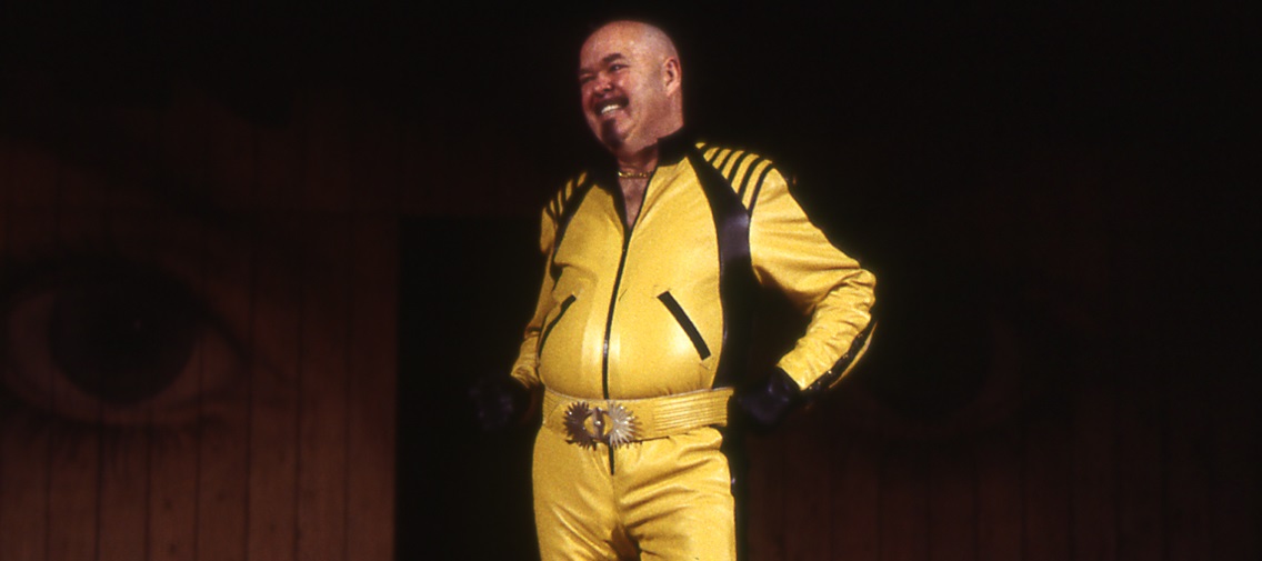 Malvolio in his yellow motorcycle outfit.