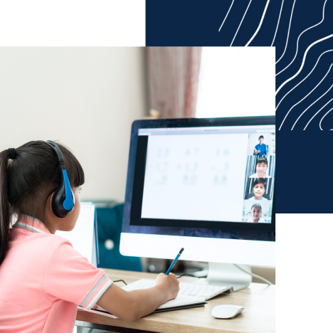 Girl working at computer with headphones