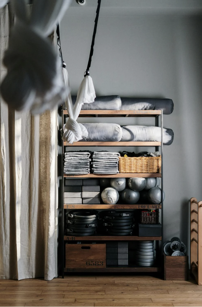 a shelf of yoga props