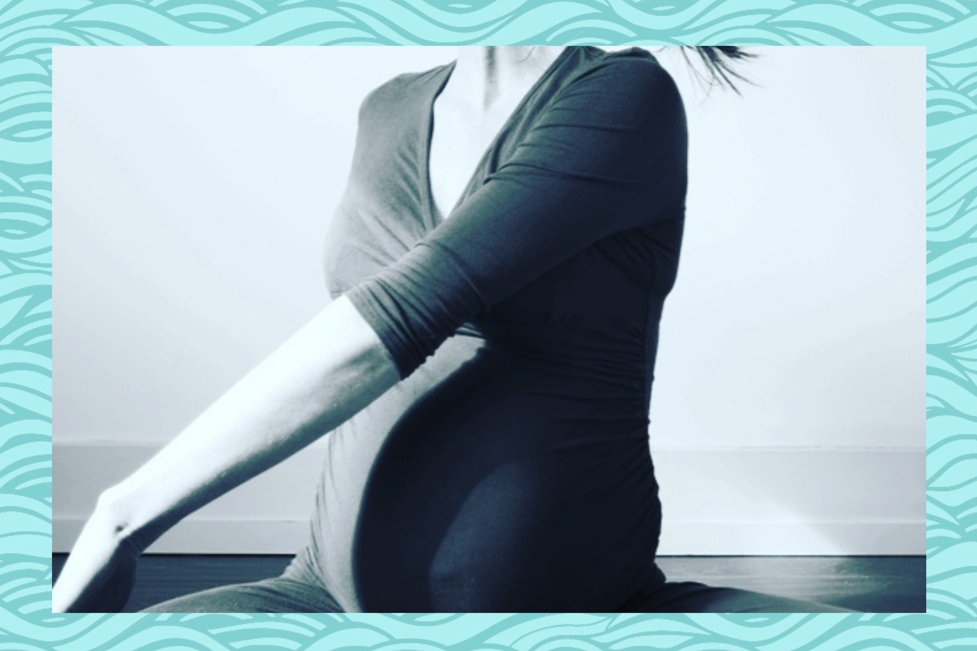Pregnant woman practicing yoga seated