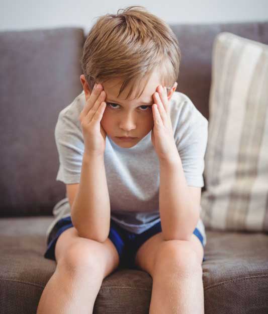 Child holding his head