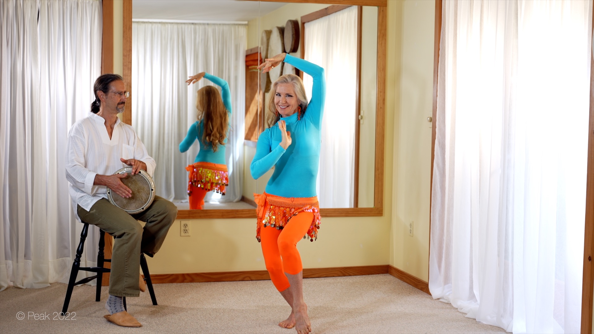 Jensuya belly dancer showing Bob and drum in studio