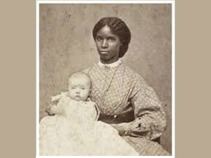 Photo of black slave wetnurse with white baby