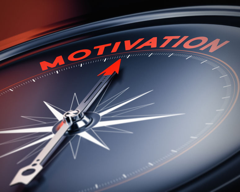 Picture of a compass pointing to the word motivation