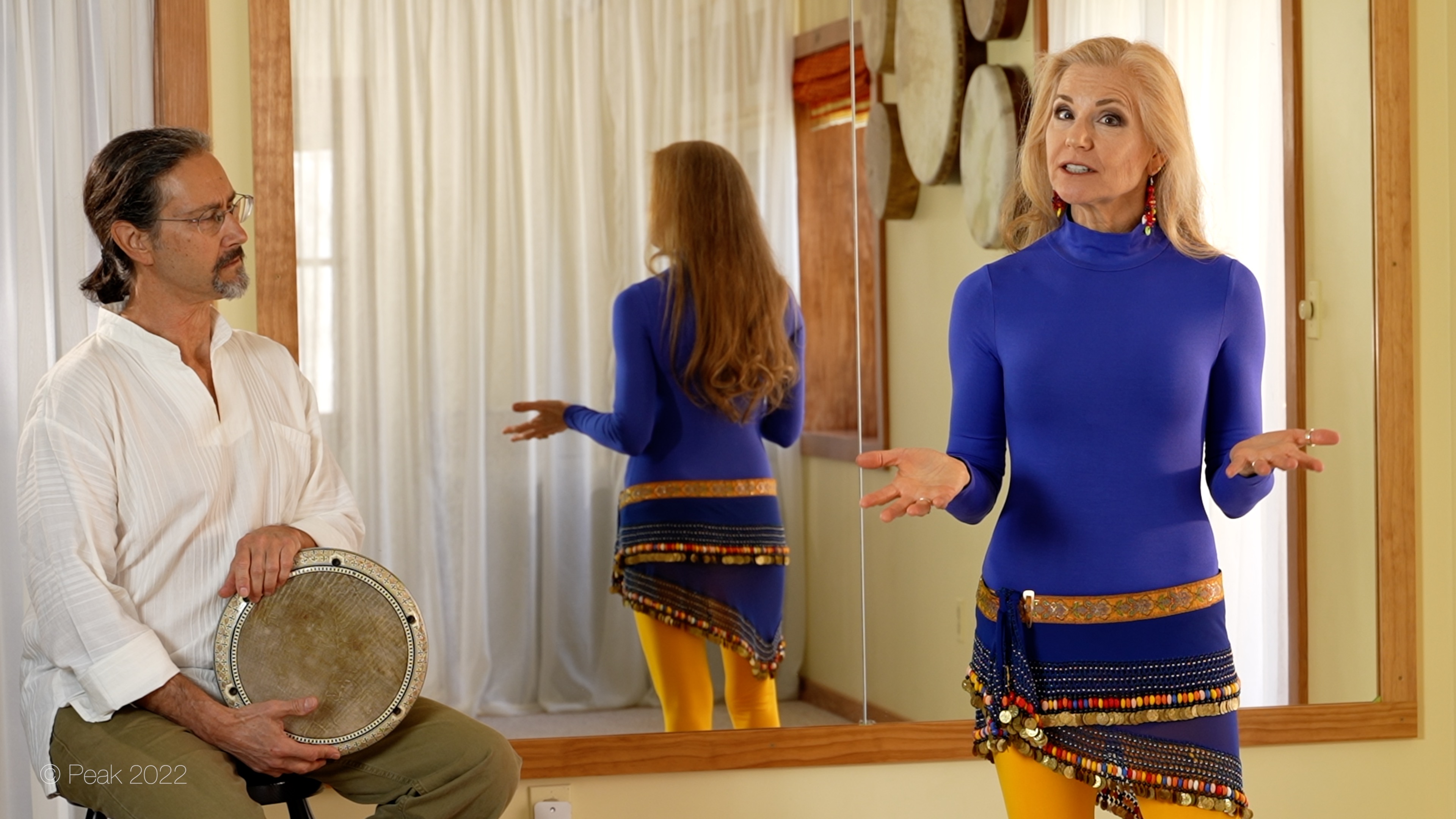 Jensuya belly dancer showing Bob and drum in studio