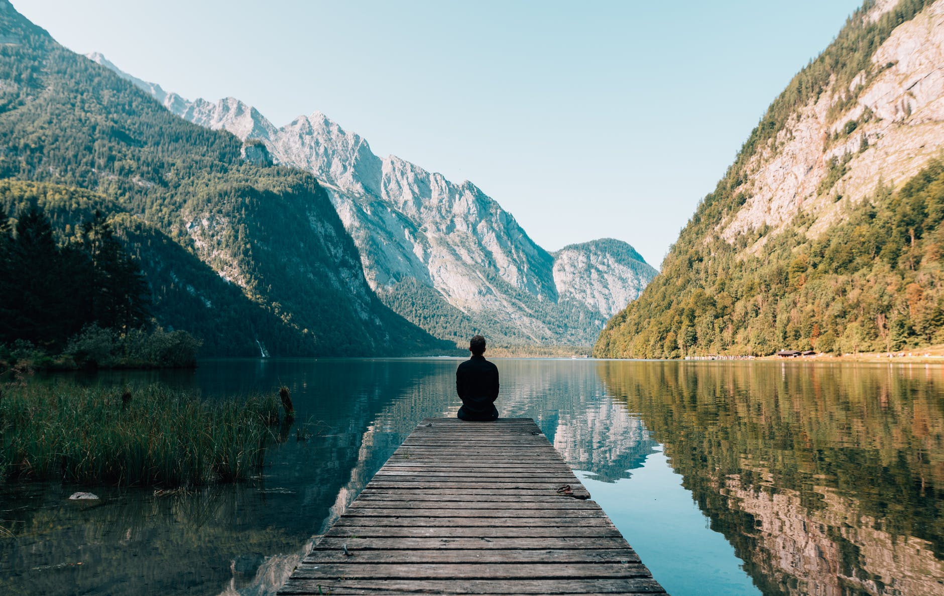Man meditating in the mountains.
