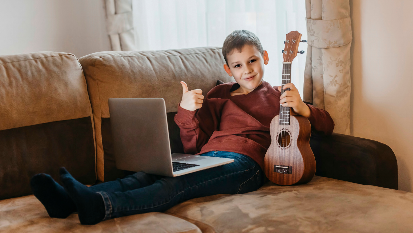 boy learning ukulele online