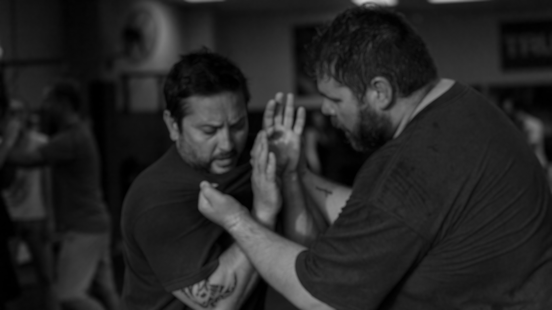 Two men training hand-to-hand combat
