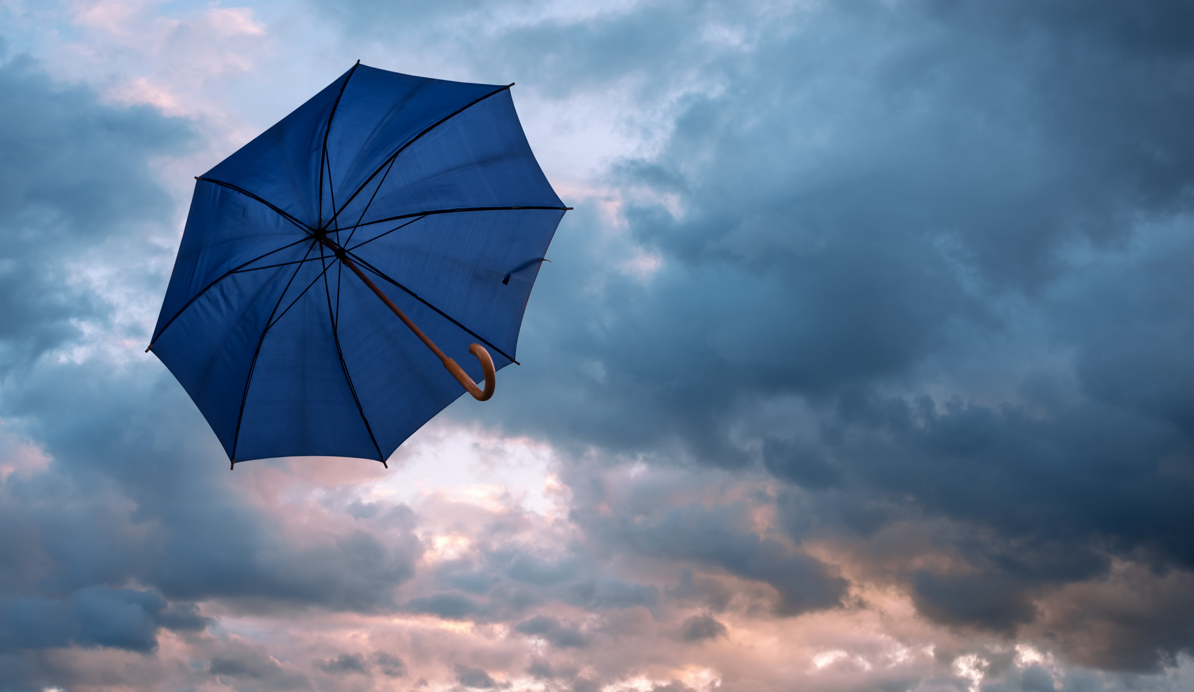 Umbrella floating in the clouds