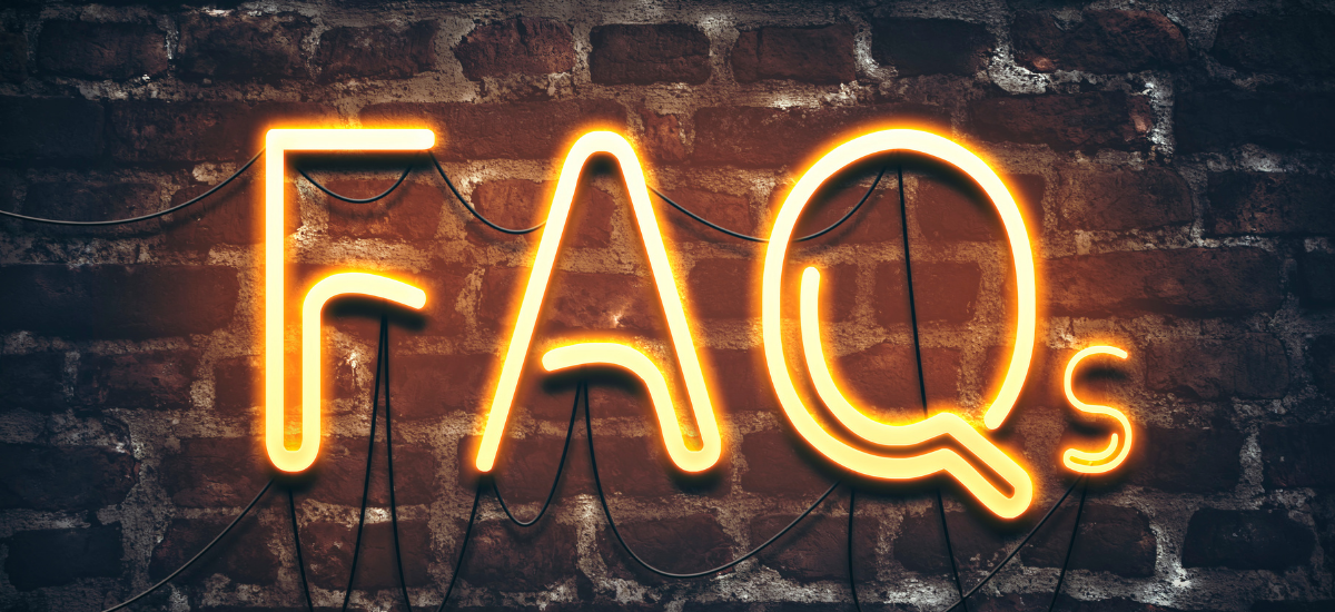 FAQ neon sign on brick wall