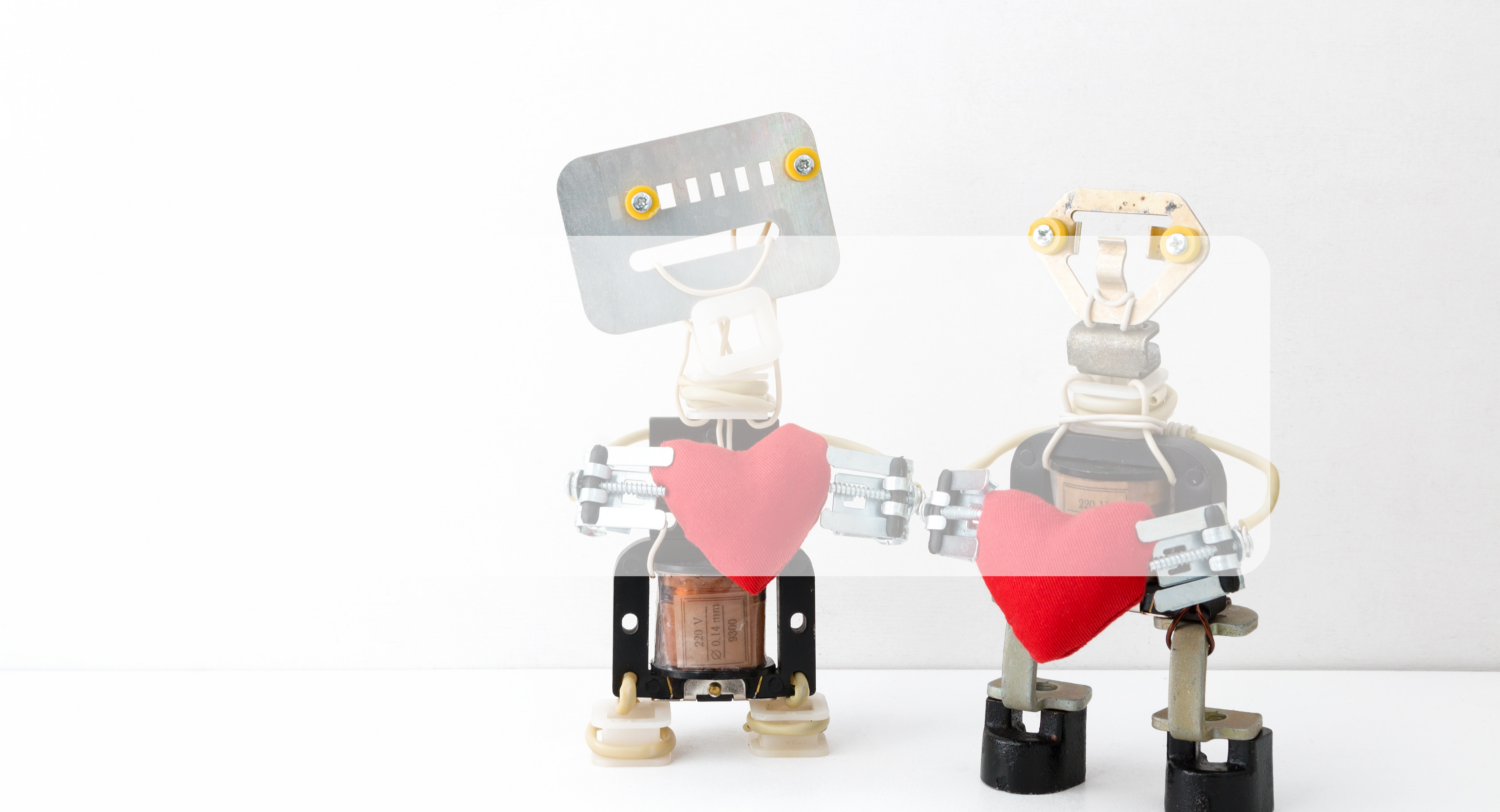 robots holding hearts