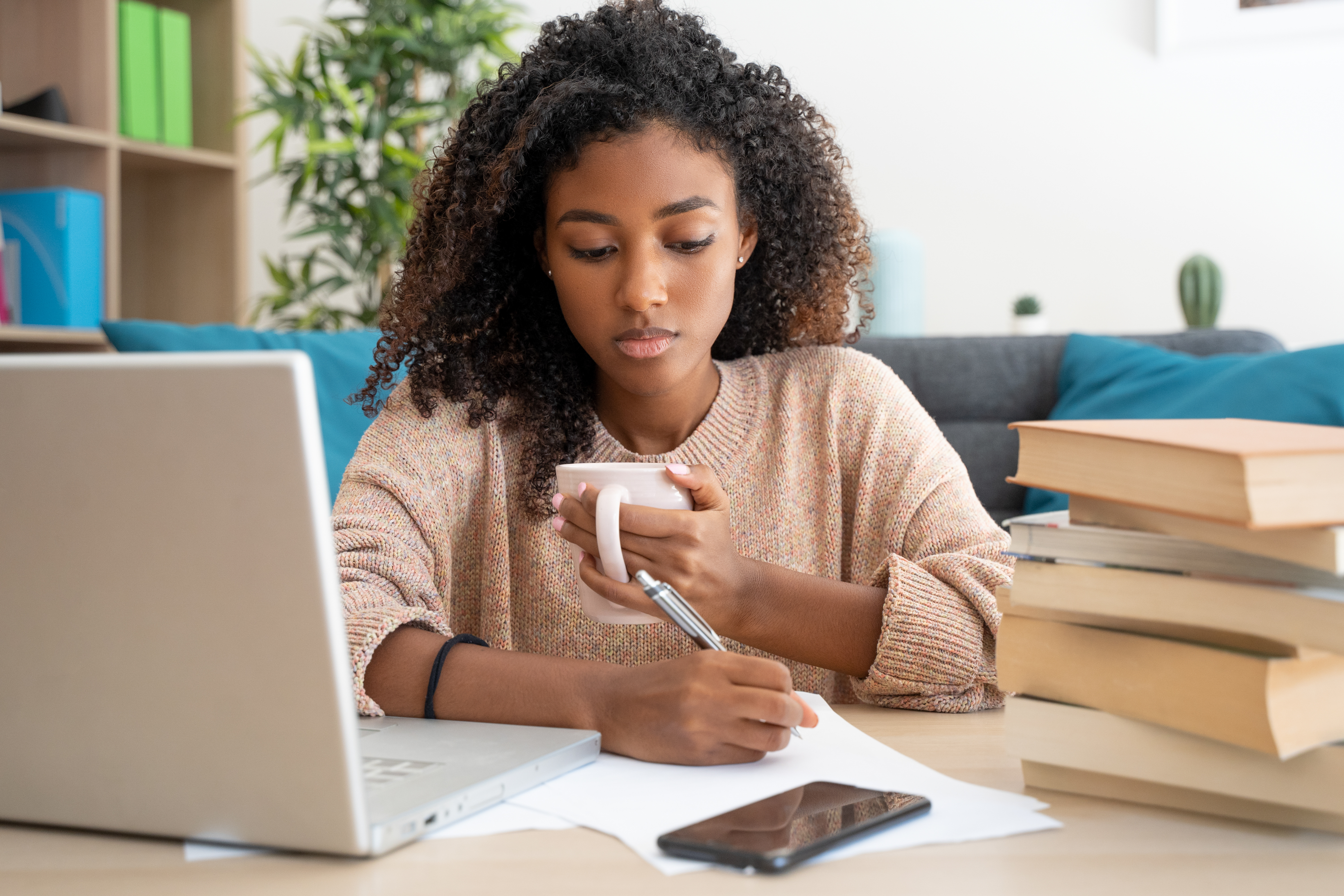 Nakhti University girl doing homework on laptop