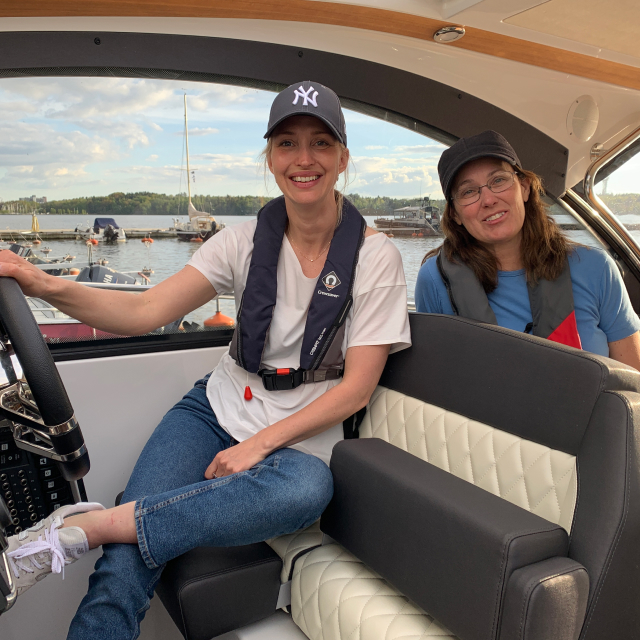 Female captain at the helm with boat coach Maria Lannér, Neptunia Boating