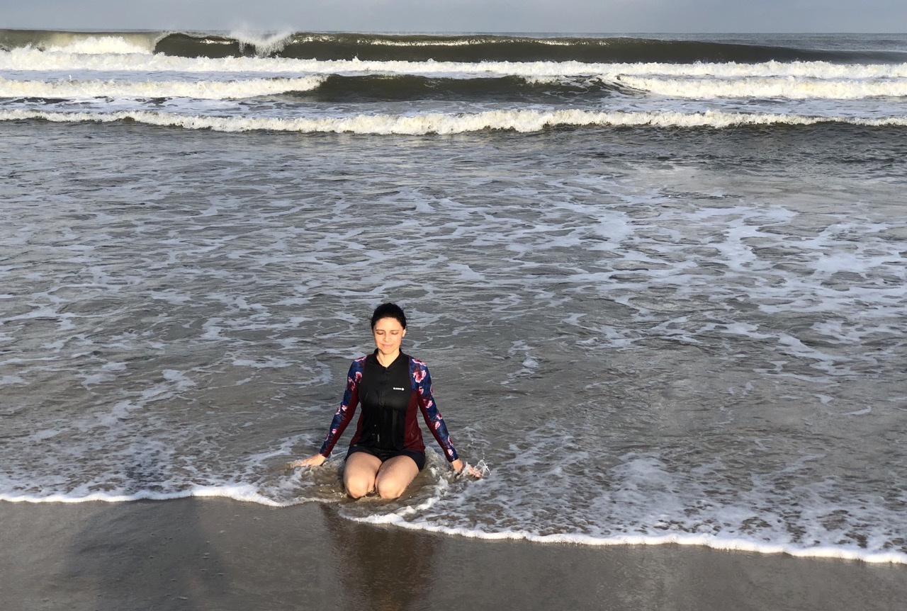 karina sitting in the ocean