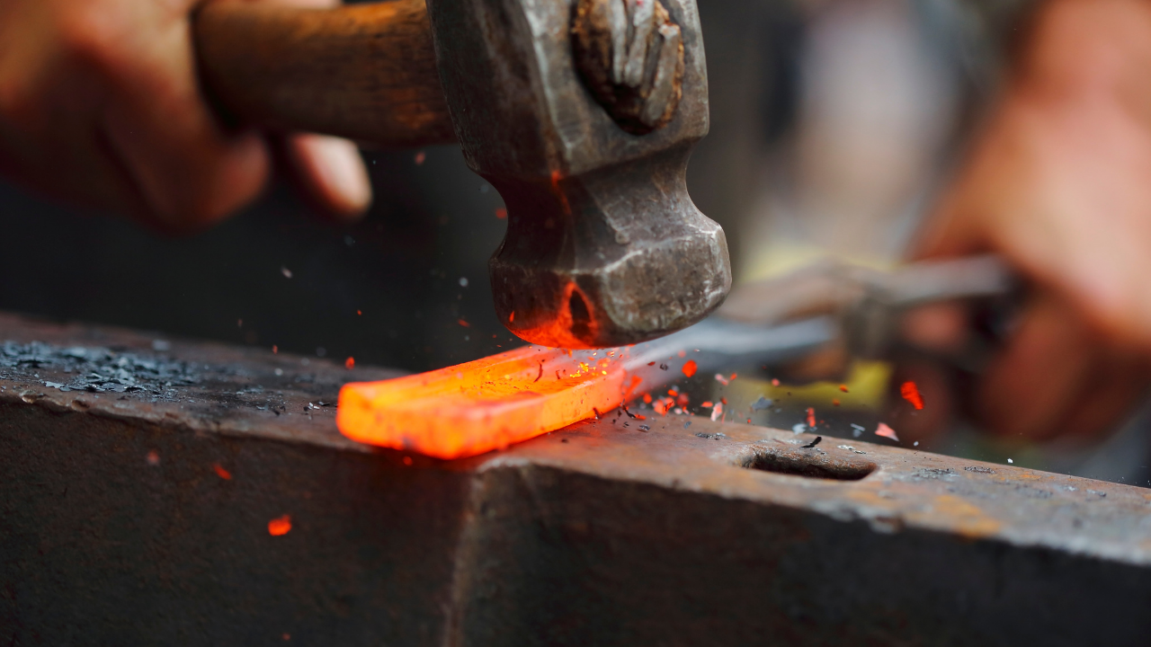 Yori Seeger hammering on hot metal