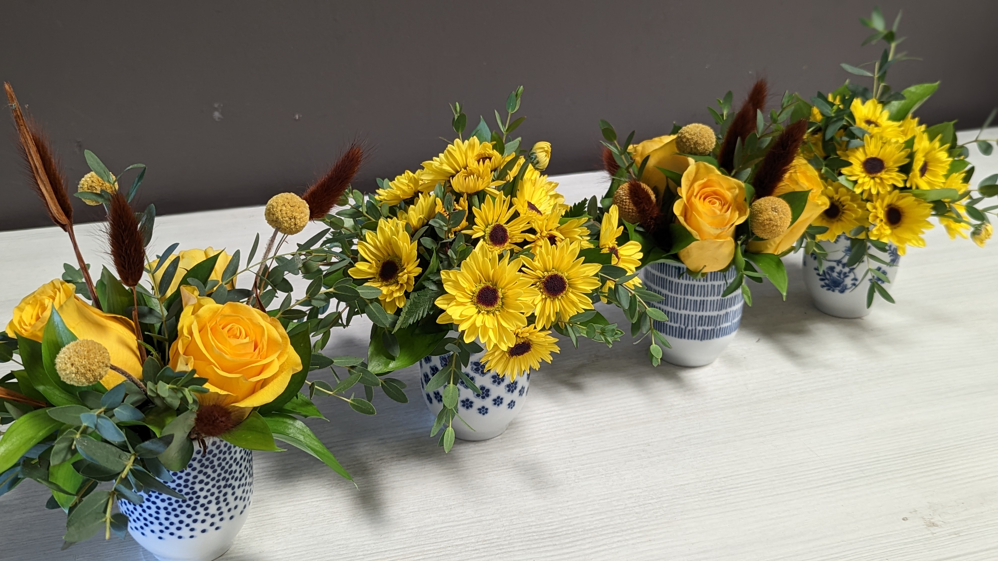 Blue and White Vases with yellow and Brown flowers