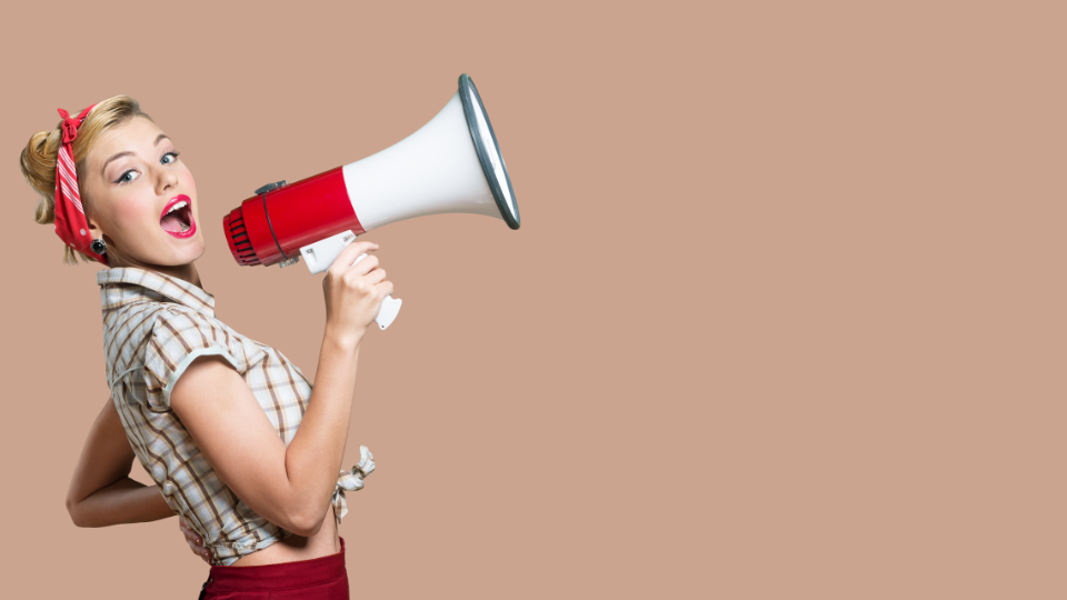 Woman in vintage clothes with megaphone