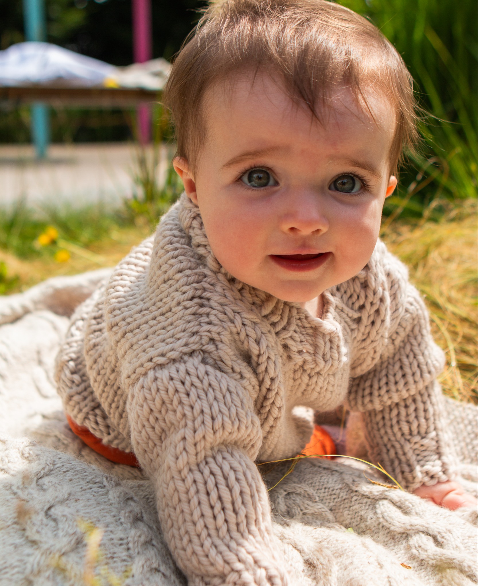 Baby wearing small version of the Formida Sweater