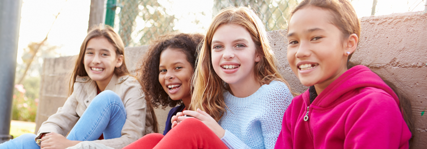 Tween and young teen girls learning life skills and smiling about it!