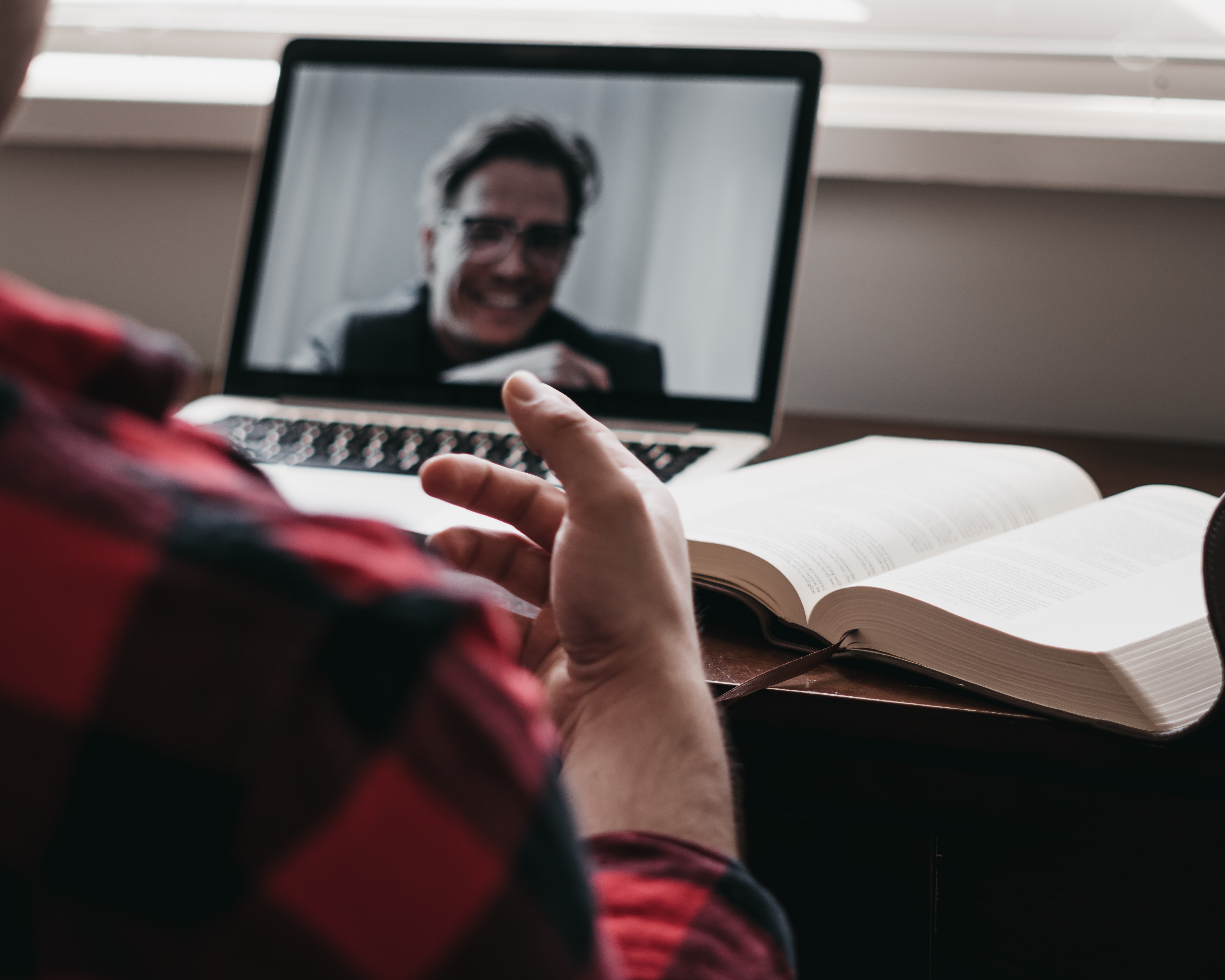 Two writers interact with each other through their computer screens.