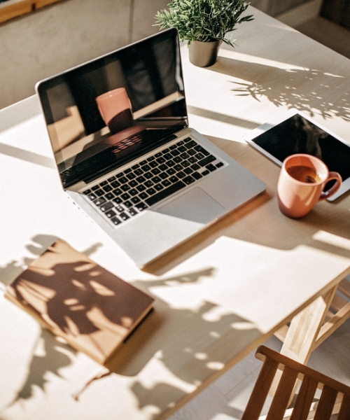 Desk with computer and coffee