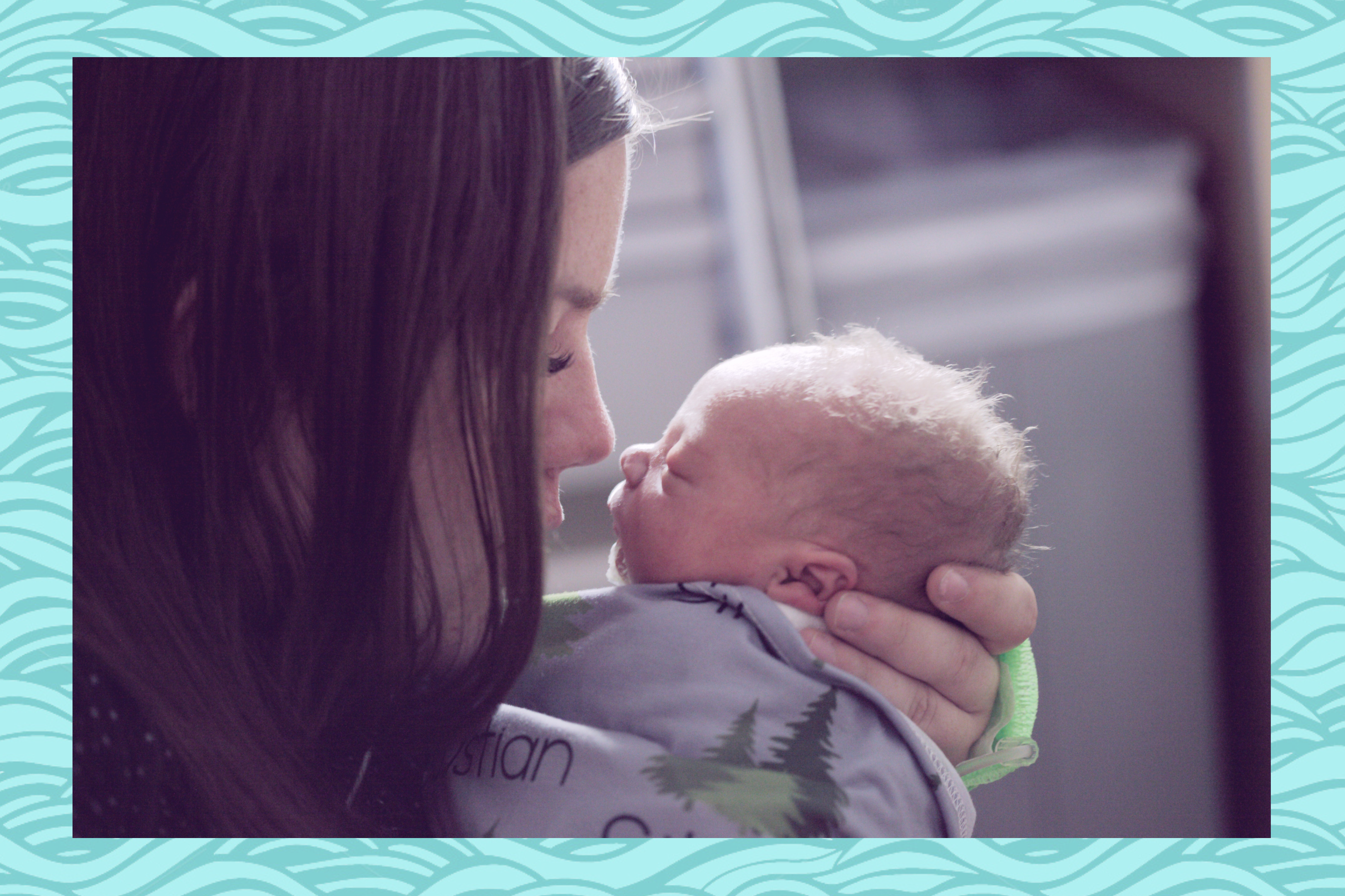 women with newborn baby in hands