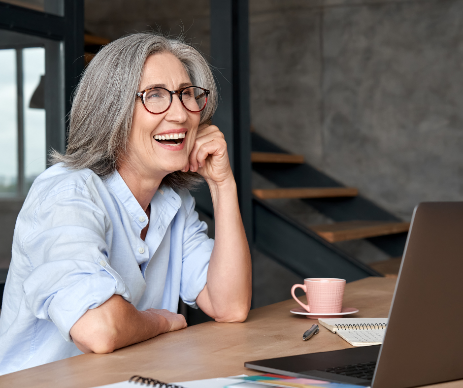 woman at desk with coffee