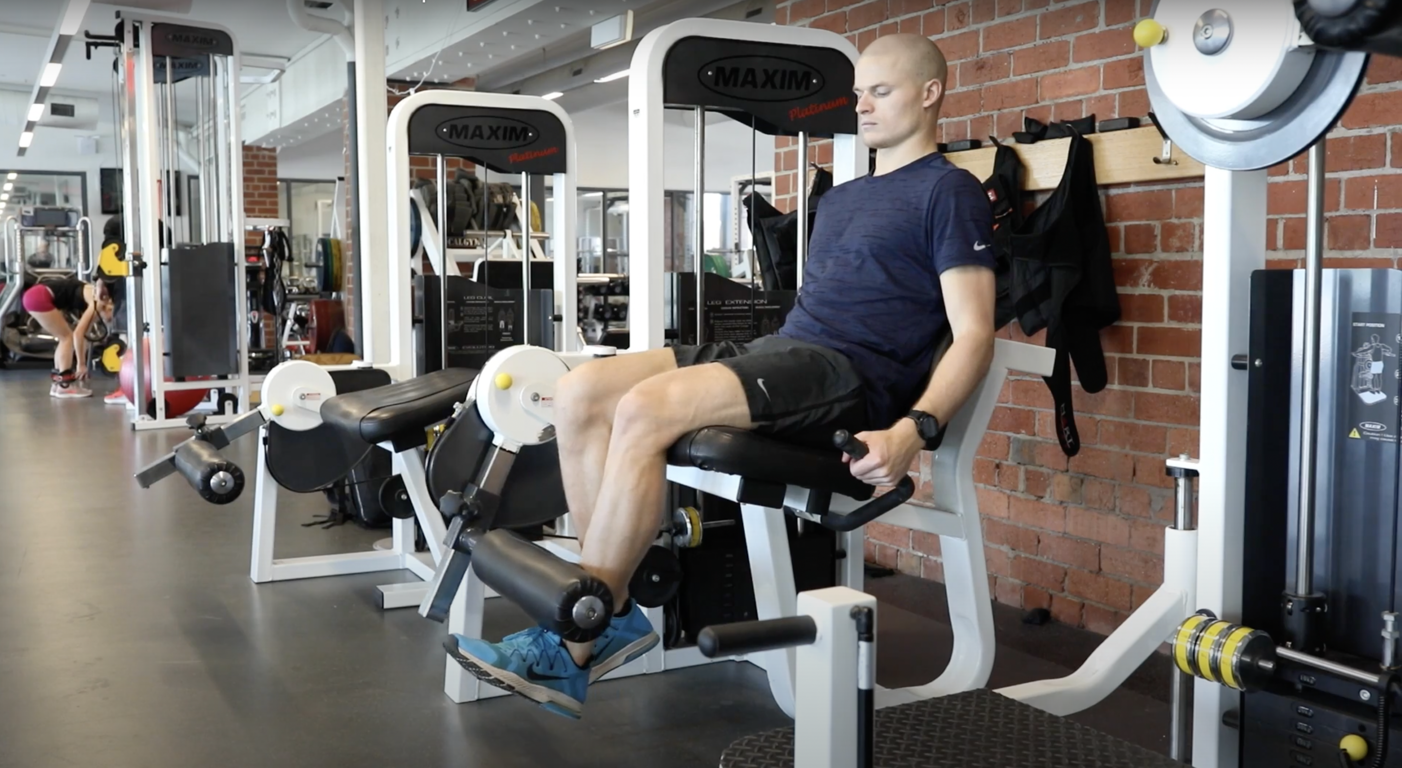 Image: ACL Rehab Post Reconstruction. Man doing quad extension exercises to aid ACL recovery.