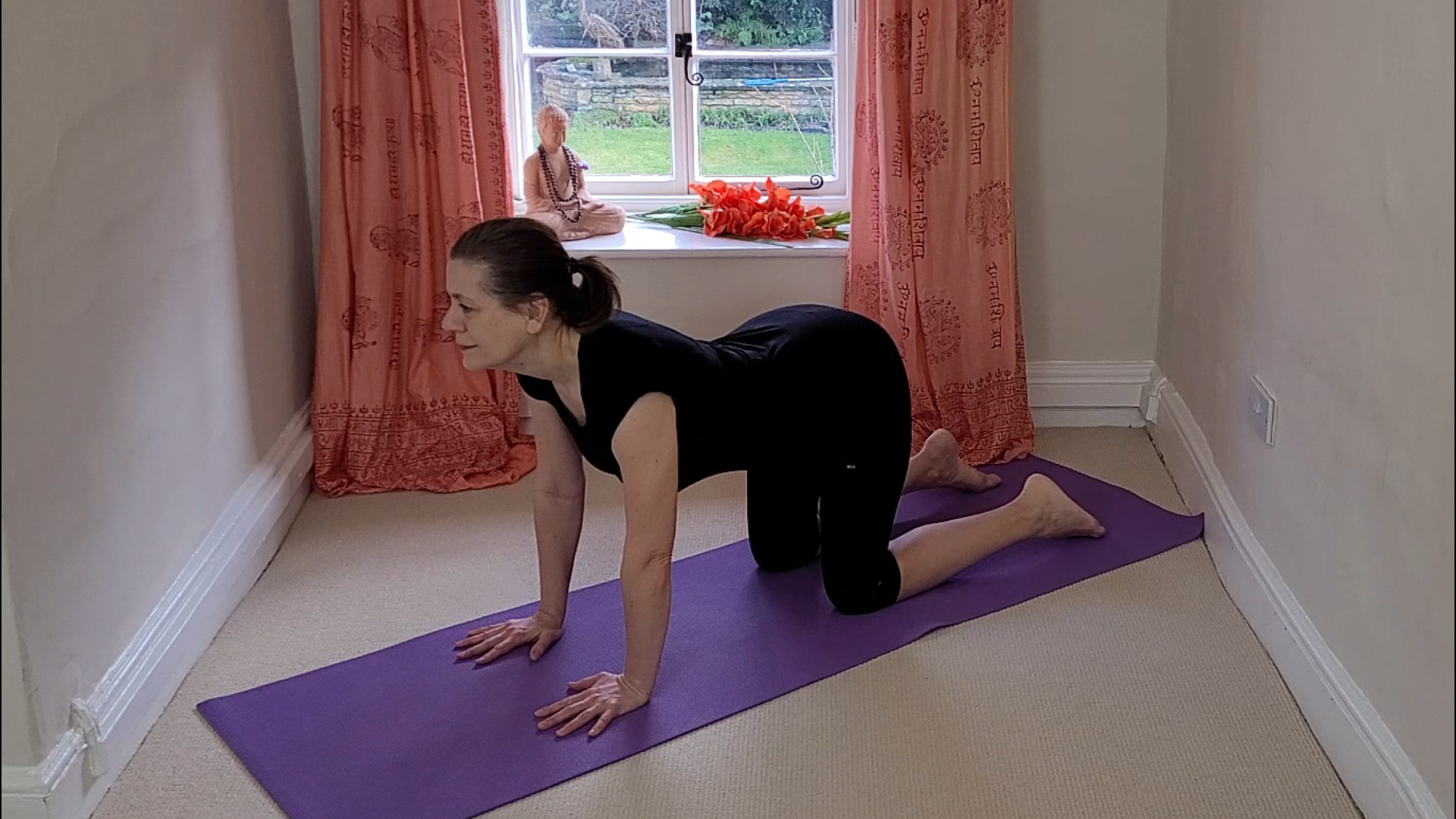 Yoga teacher Deb King demonstrates Marjariasana