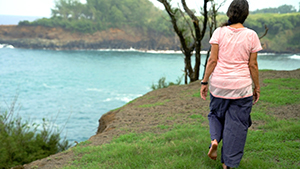 Michele McDonald doing walking meditation along the coast.