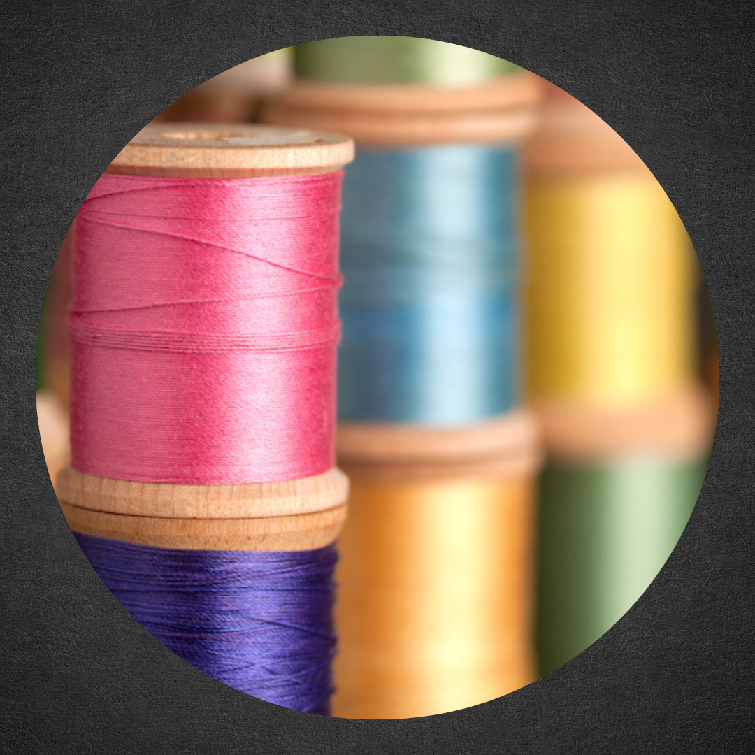 photo of multiple colored spools of thread