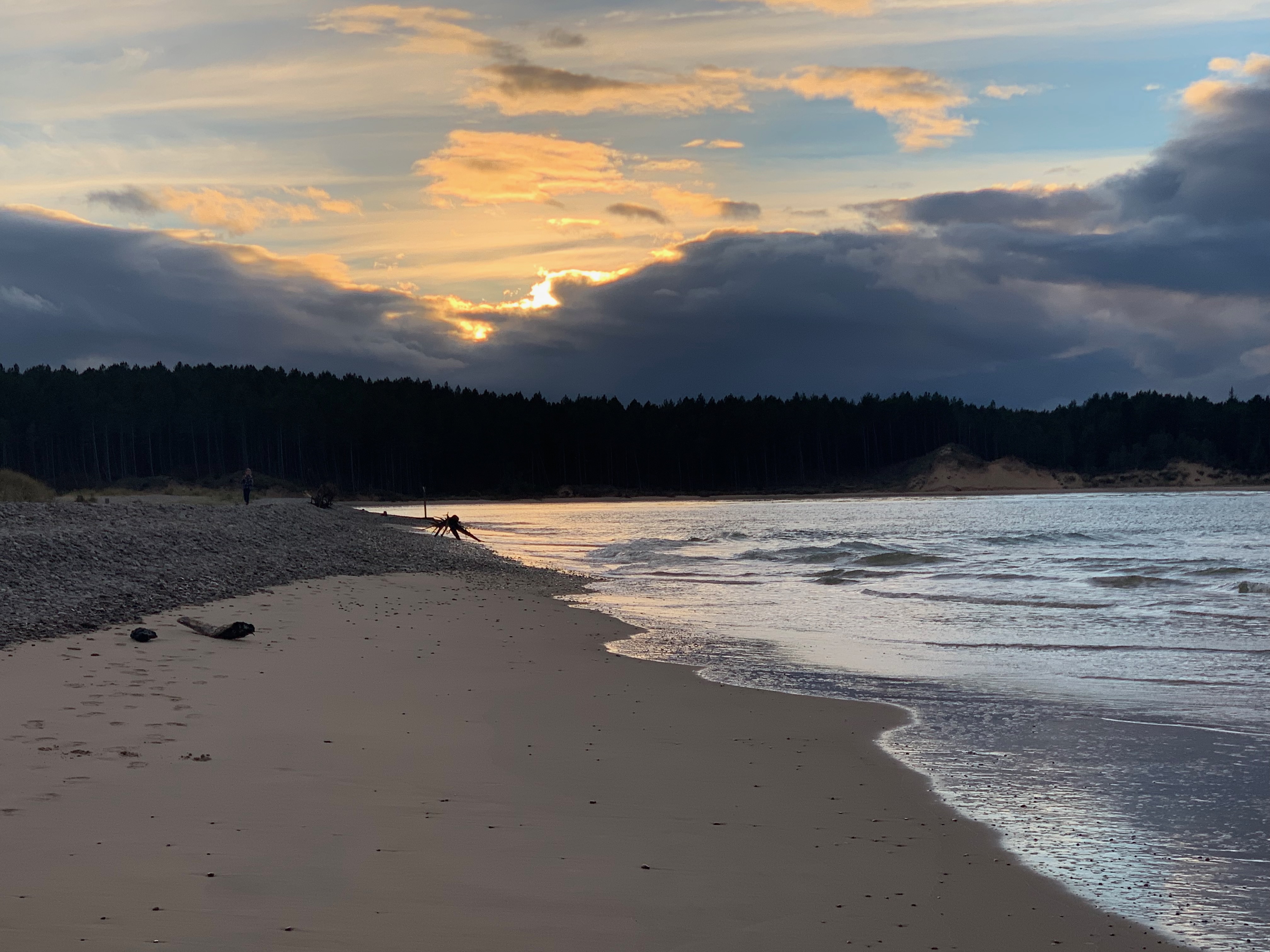 The sunset over Findhorn Bay in Scotland, a moody cloudly picture