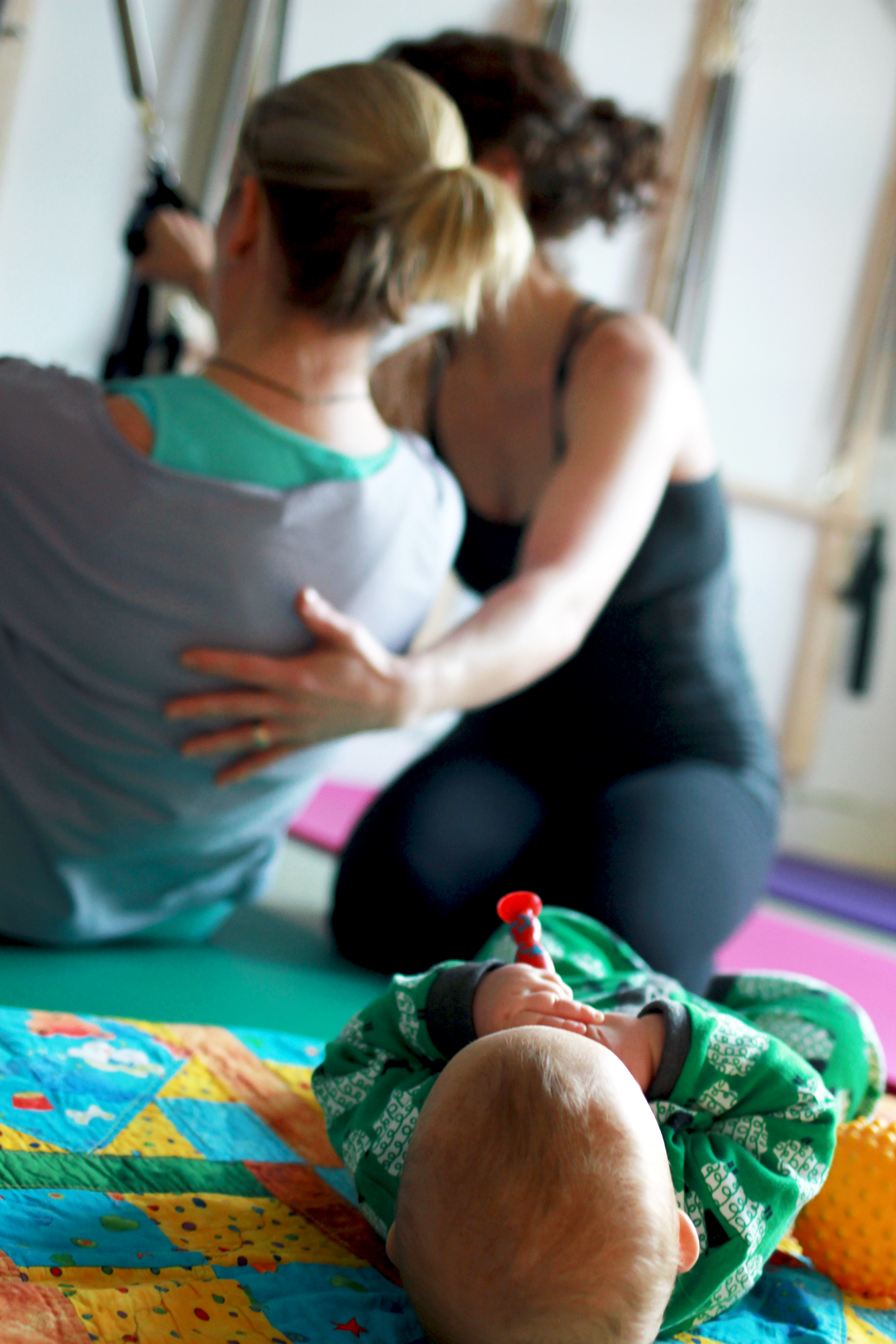 Pilates while baby plays