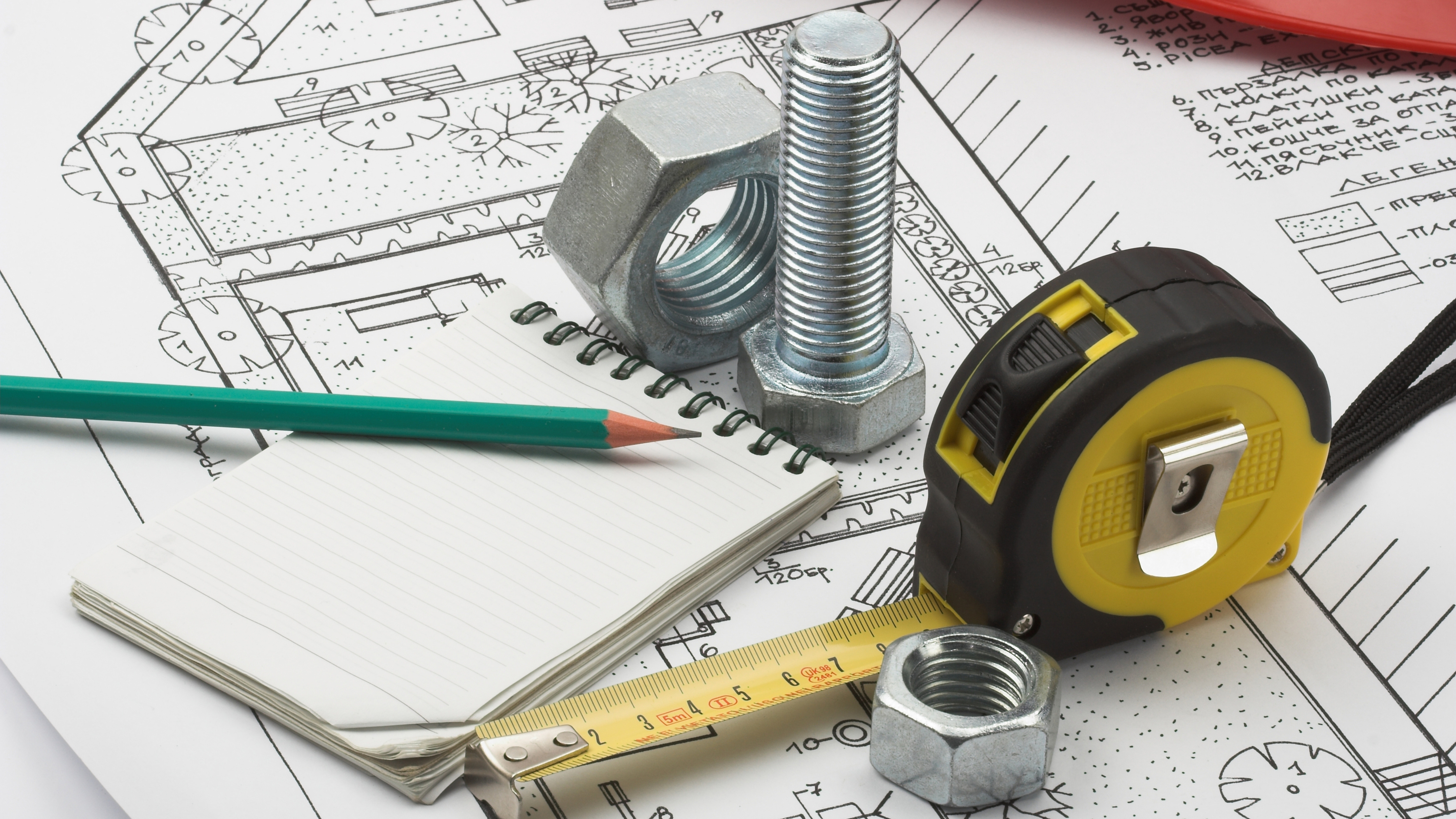 tape measure, blueprints, and engineering tools