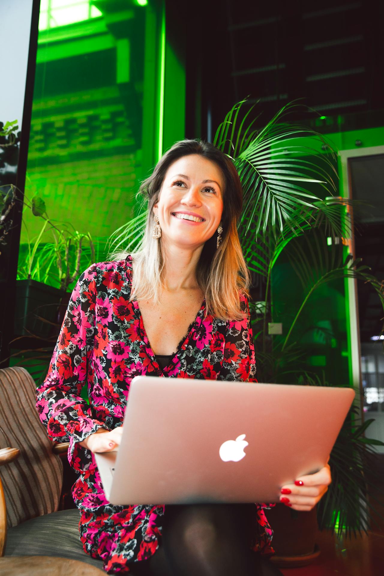 woman smiling at her laptop - photo via Polina Zimmerman/Pexels 