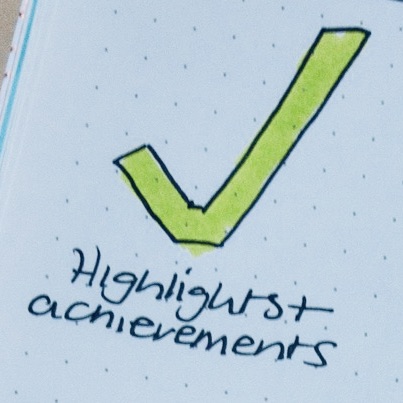 an image of a hand drawn tick mark with the words: Highlights and Achievements