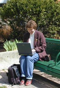 Karen working outside on her laptop