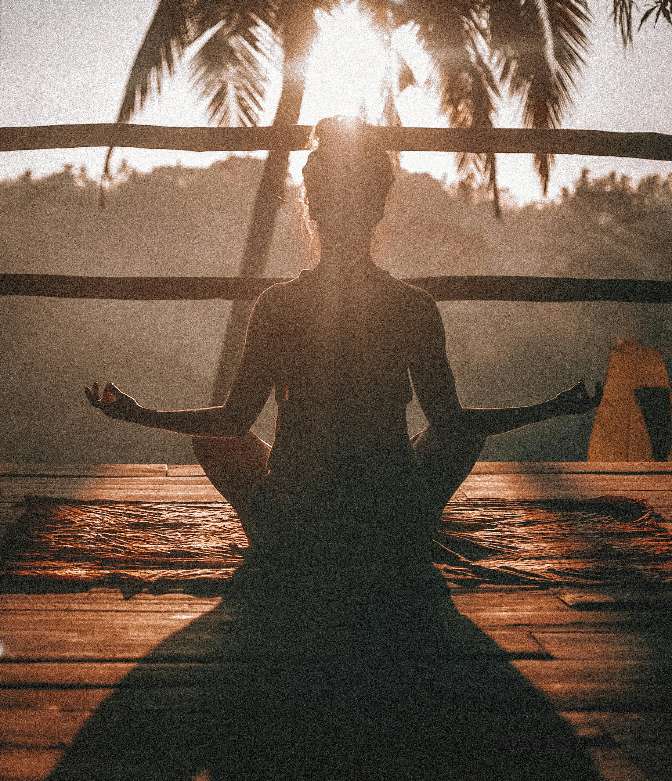 woman meditating on deck