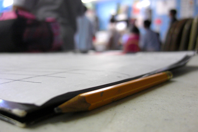 Picture of a pencil beside a notebook signaling simple lessons.