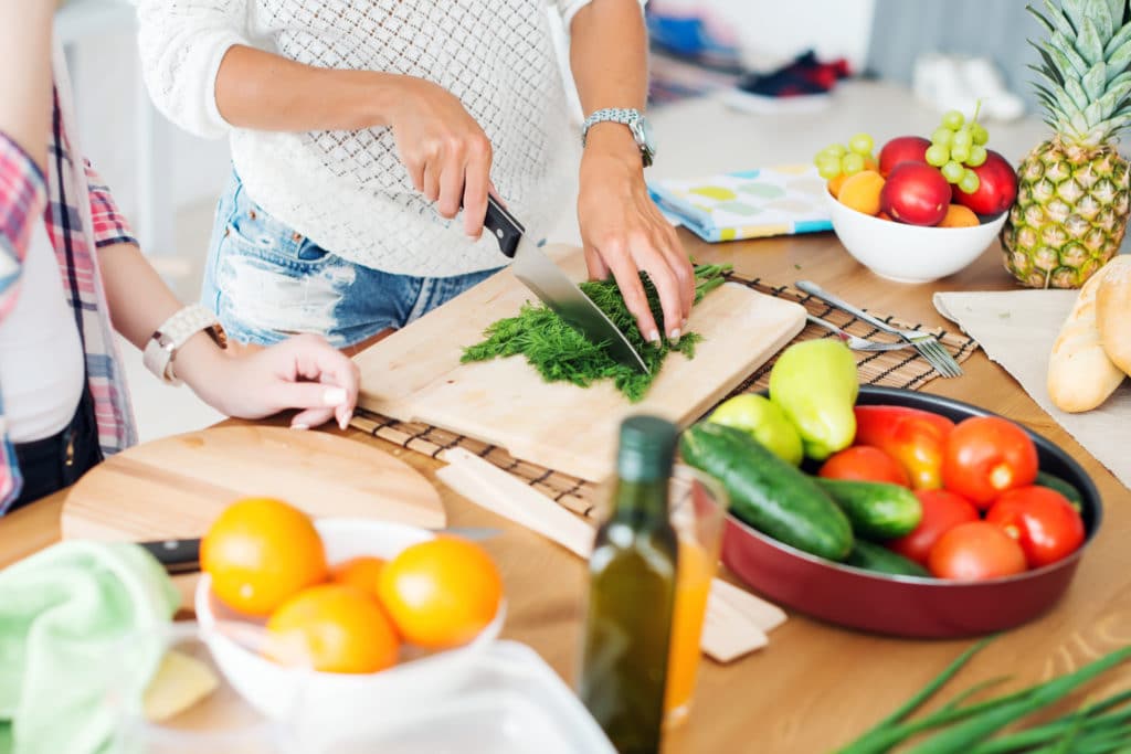 Galveston Prime for Young Adults, Picture of Beautiful Young Women Chopping Vegetables 