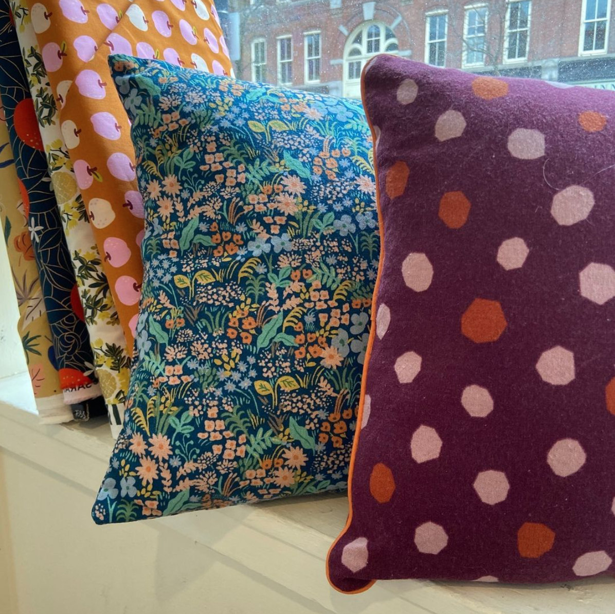Group holding pillowcases they made