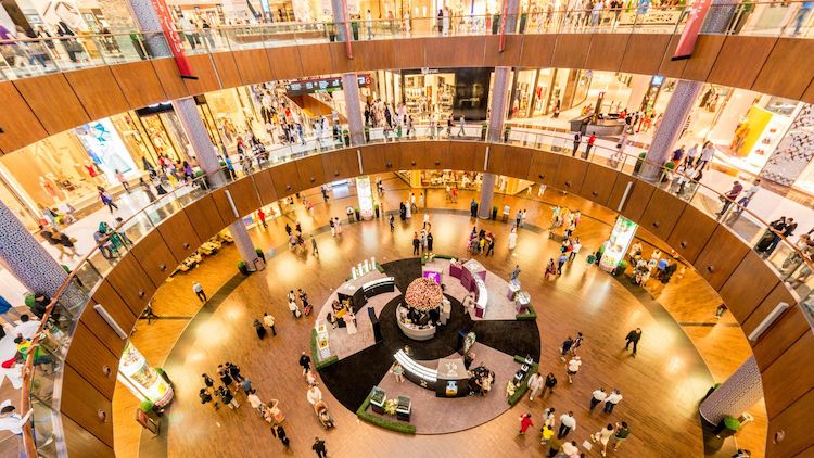 view of crowded malls multiple levels of shops