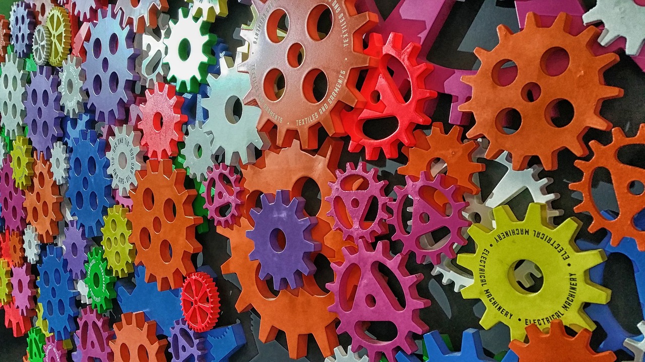 a wall of gears, interconnected, in vibrant colors