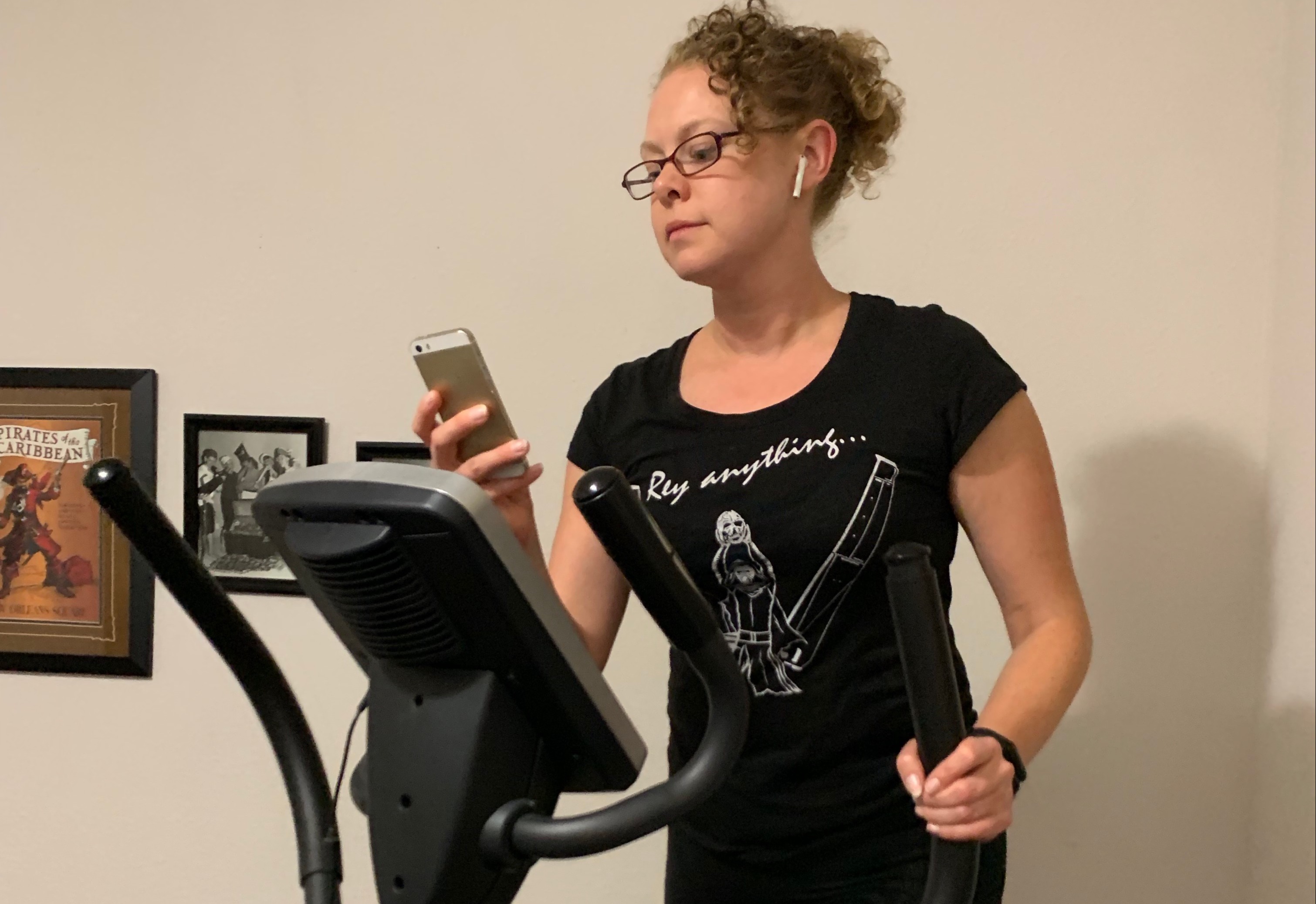 Working out on an Elliptical machine, while working on an iPhone.