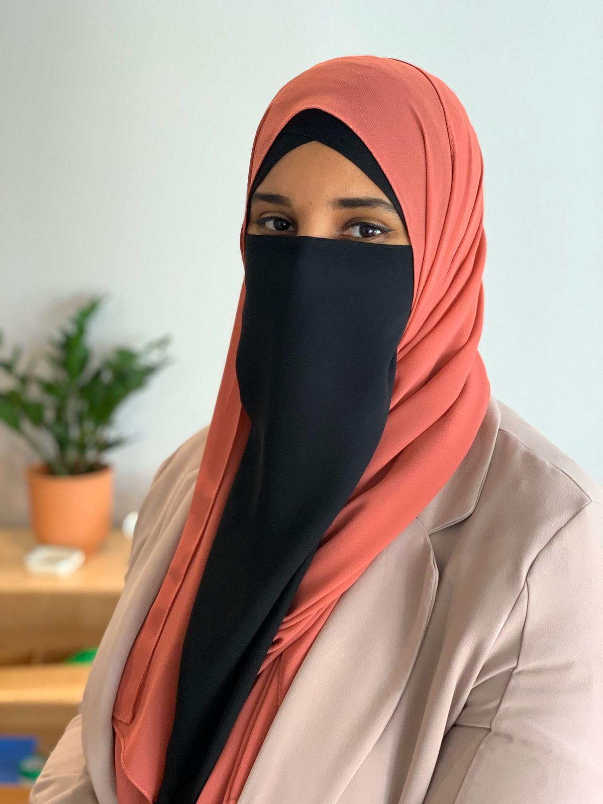 Photo of Layla Graham orange hijab black niqaab